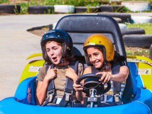 Campers having fun go-karting.