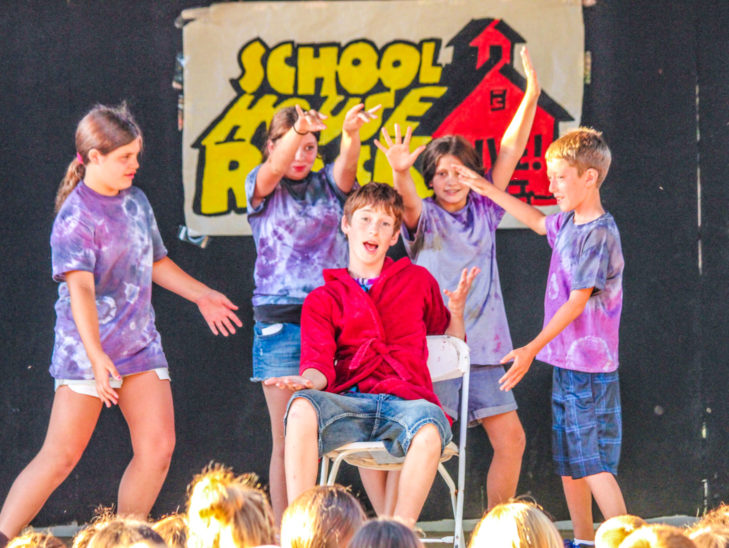 Campers performing a skit in front of an audience.