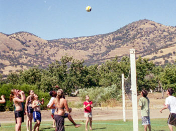 Campers playing volleyball.