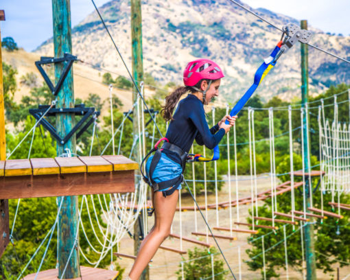 A camper about to jump down a zip line.
