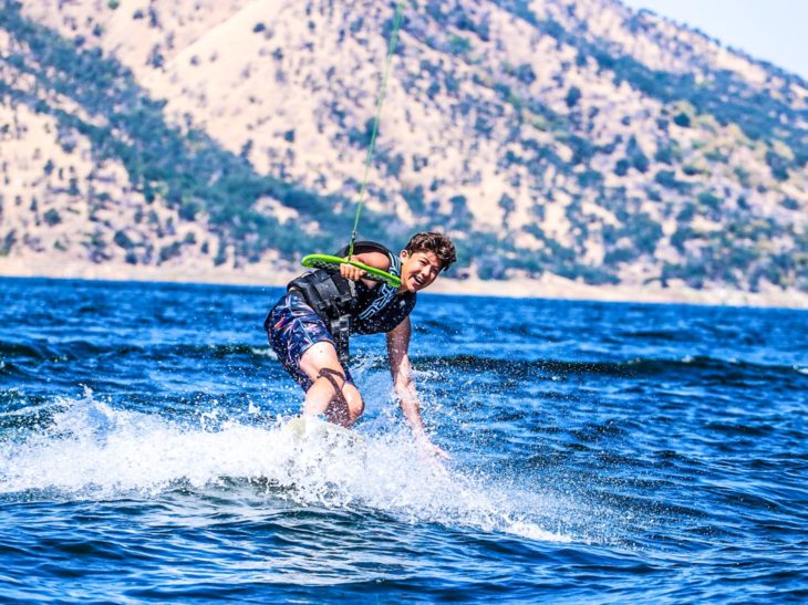 A camper learning how to wake board.